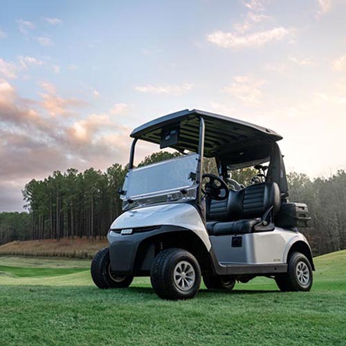 An ELiTE E-Z-GO vehicle sitting on a golf course.