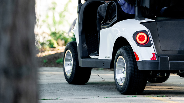 A close-up shot of an E-Z-GO golf cart from behind.