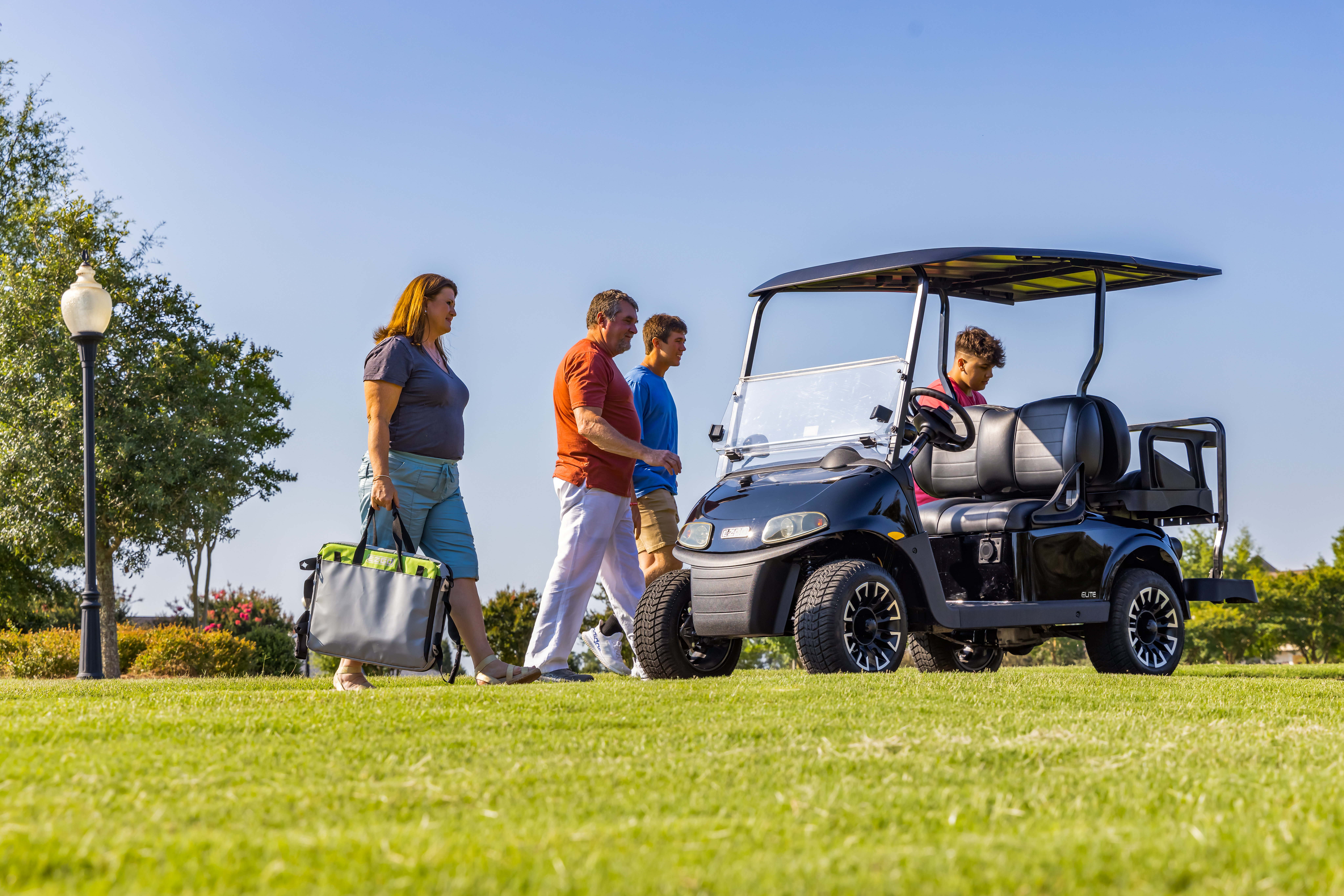 Family on a picnic with their E-Z-GO Golf Cart