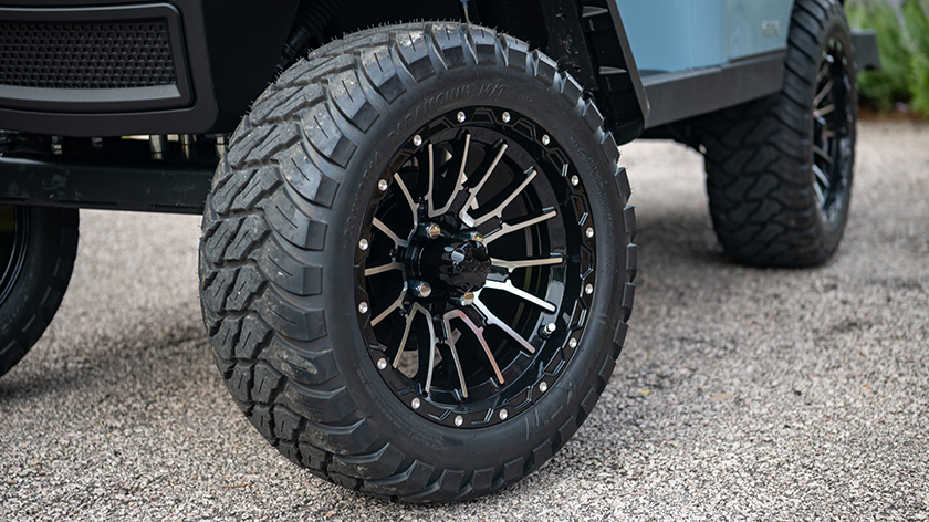 A close-up view of the premium tires on an Express S4 golf cart.