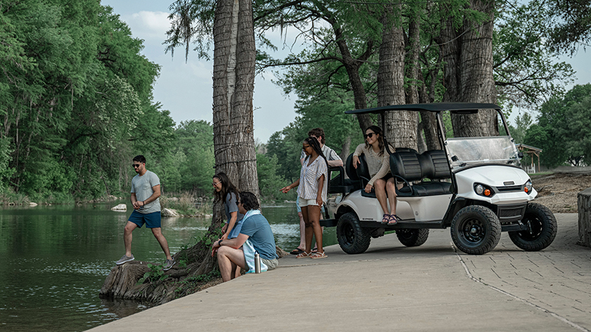 Group of friends getting out of their Express 6 to float in the river