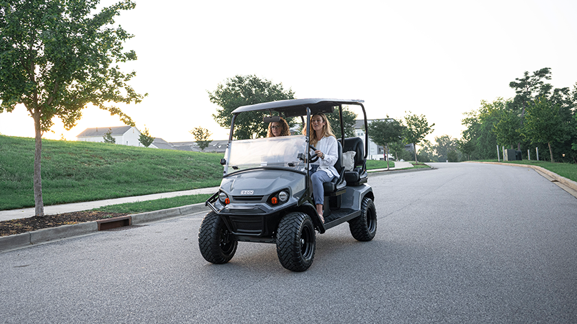 E-Z-GO Liberty driving in a neighborhood