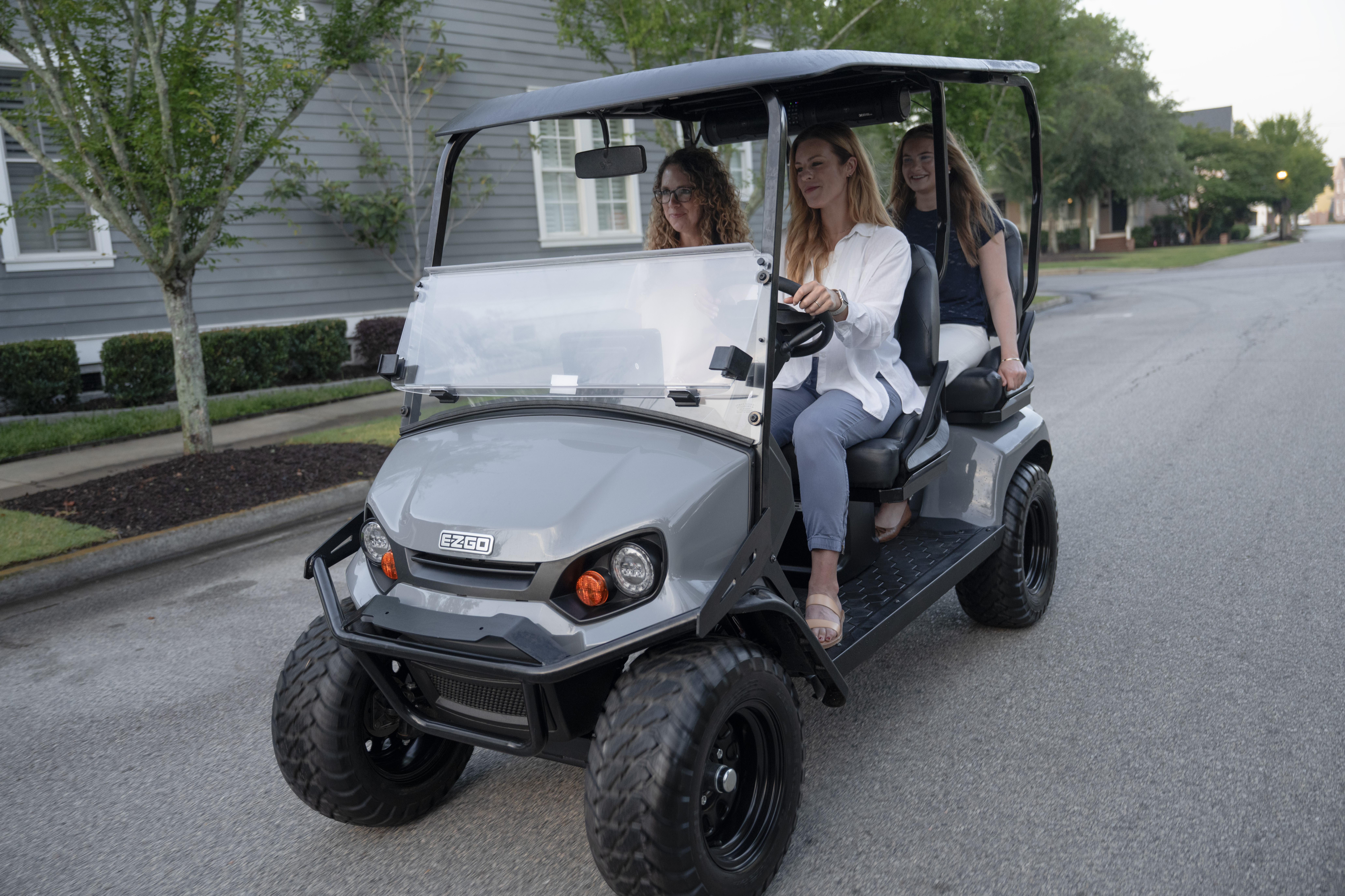 E-Z-GO 2026 Liberty driving in a neighborhood