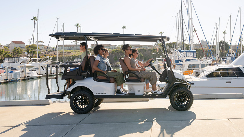 Express 6 driving past a marina/harbor