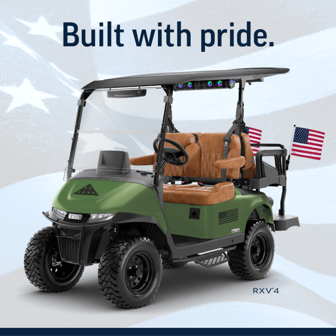 Folds of Honor vehicle with an american flag in the background. 