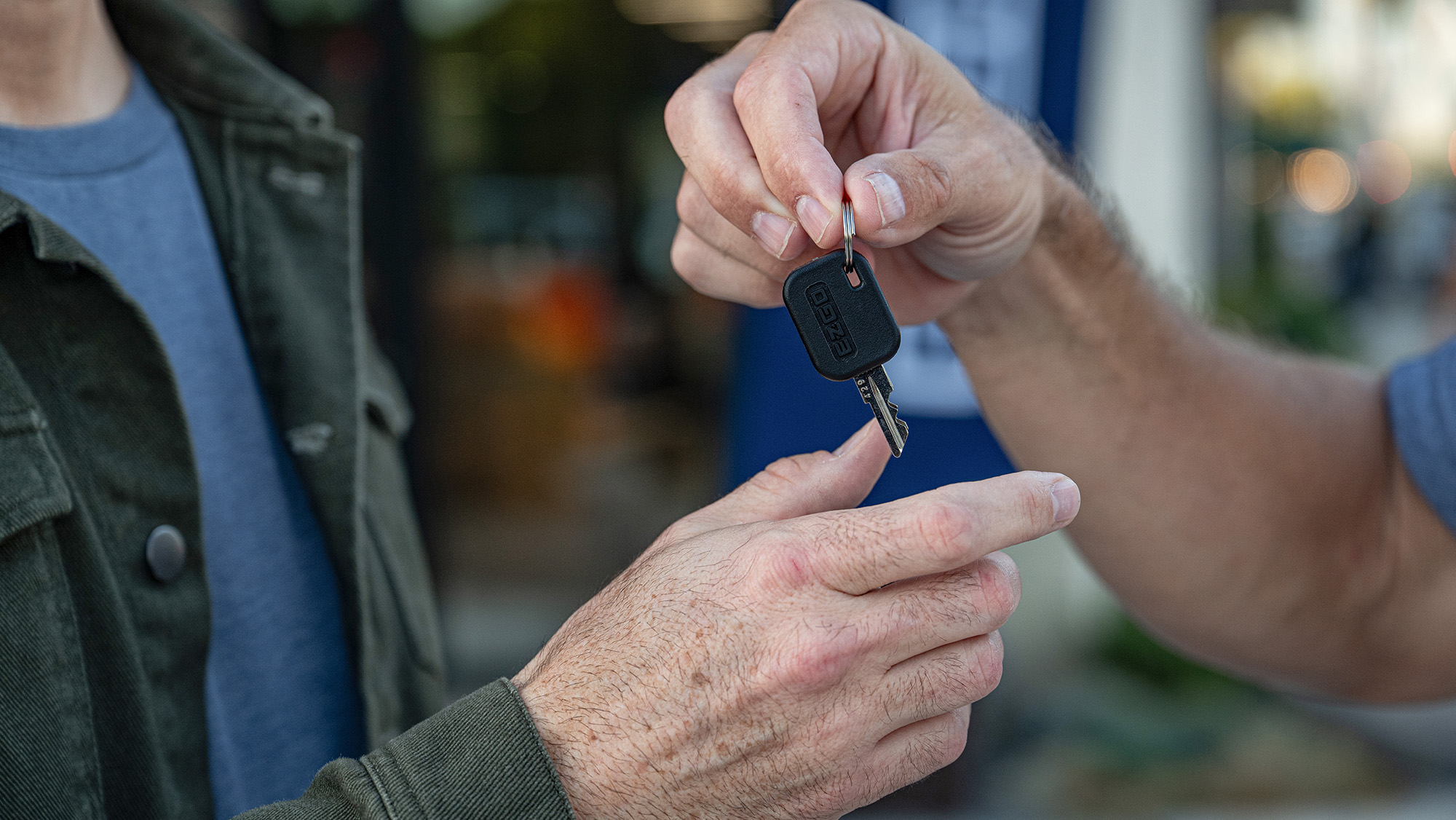 E-Z-GO keys being handed to a customer