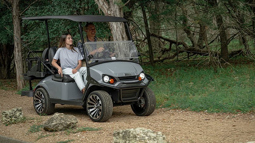 Express 4 with dad and daughter riding on a dirt road