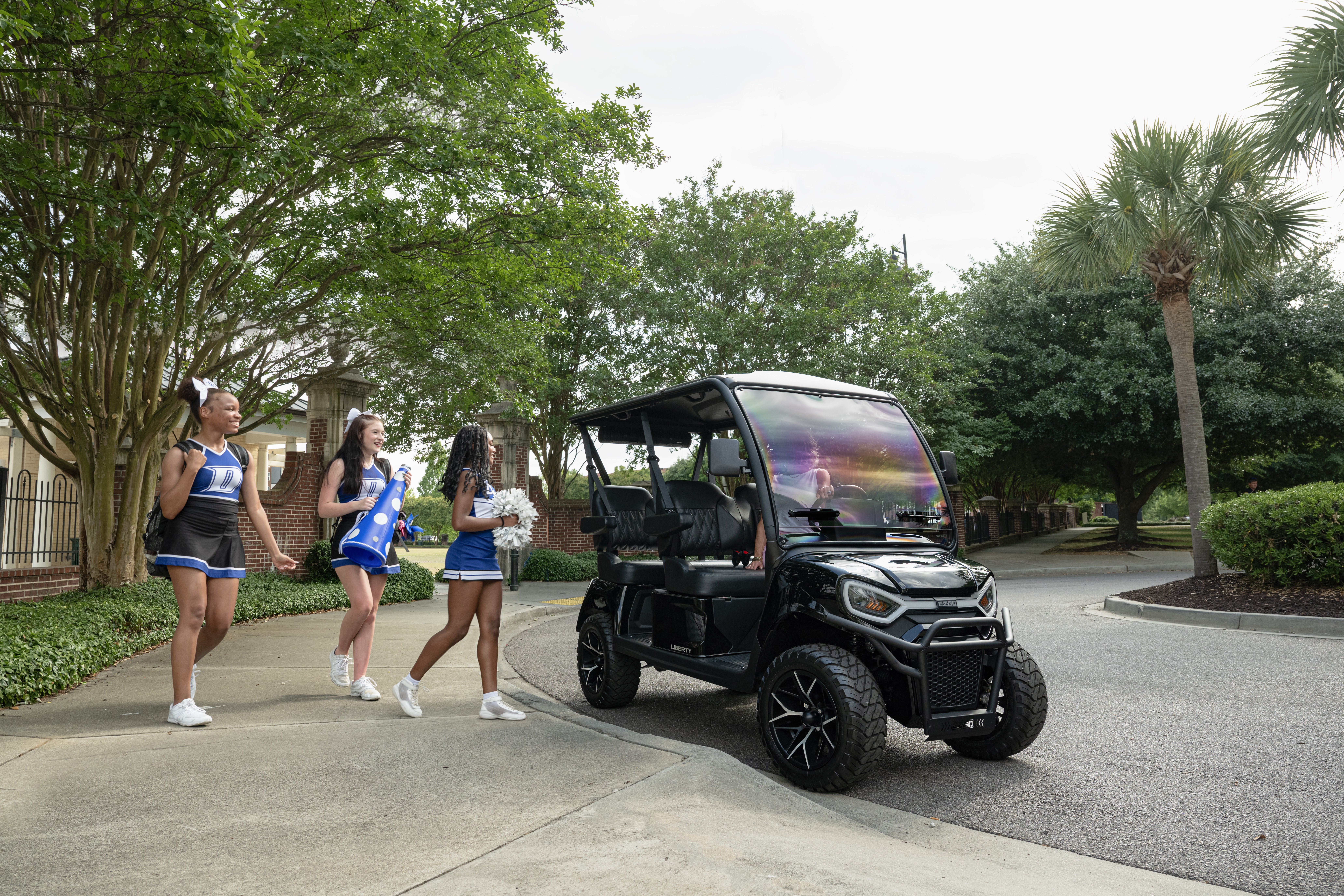 E-Z-GO Liberty 4F with four-forward facing seats with electric vehicle