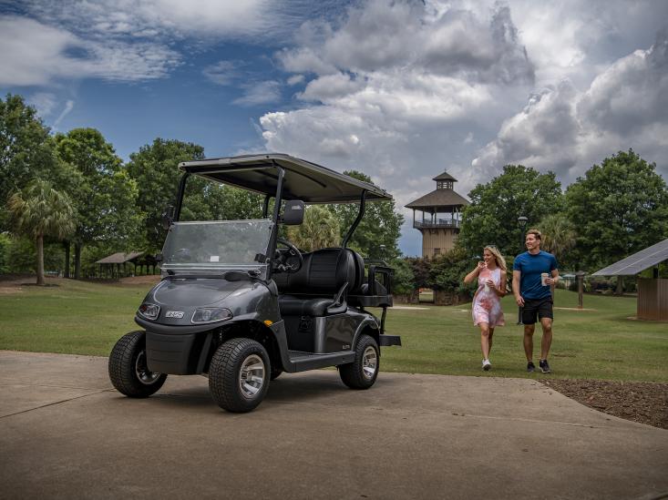 Couple with their E-Z-GO golf cart