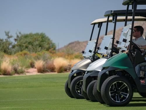 Group of 3 E-Z-GO golf carts on a golf course